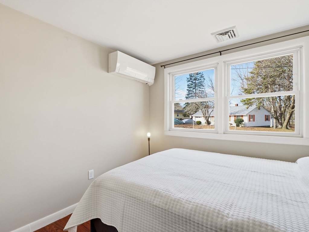 34 Beaconsfield Street Lawrence, MA 01843 - Photo 24 of 29 a bedroom with a large bed and a window