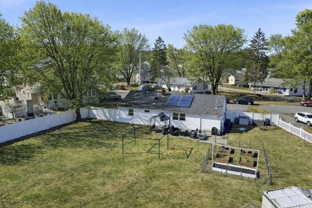 34 Beaconsfield Street Lawrence, MA 01843 - Photo 25 of 29 an aerial view of a house with garden space and trees
