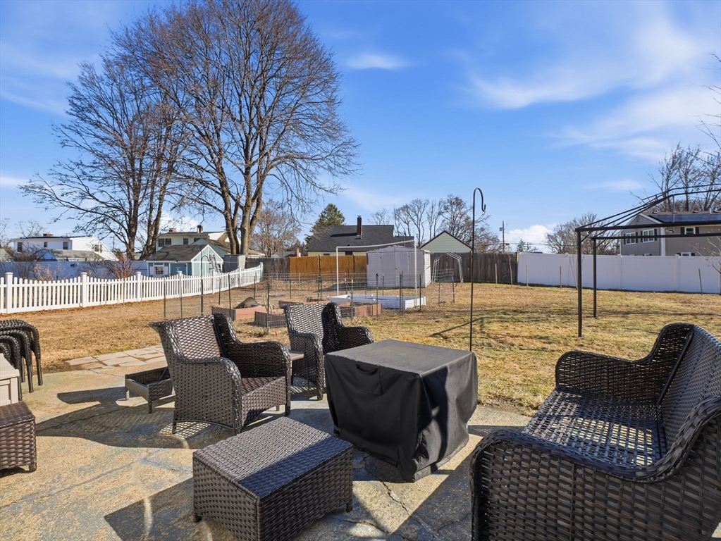 34 Beaconsfield Street Lawrence, MA 01843 - Photo 29 of 29 a view of a patio with couches chairs and a fire pit
