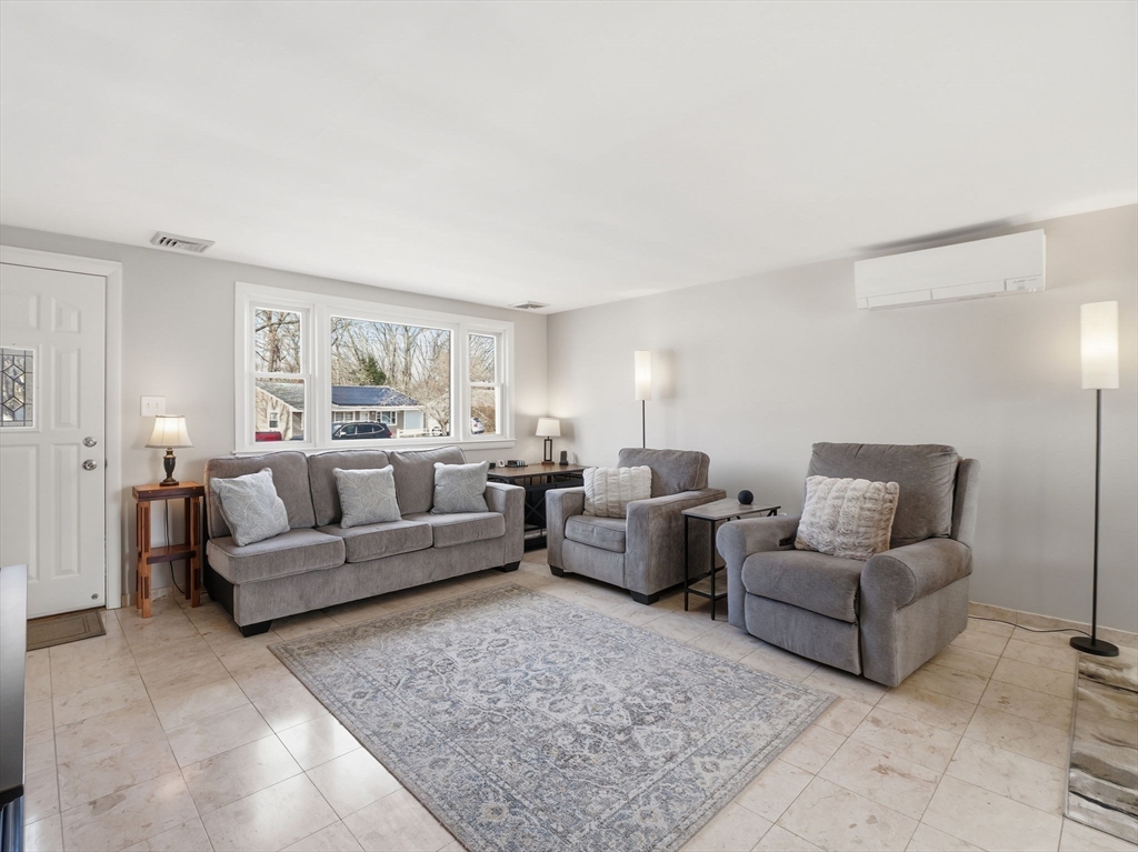 34 Beaconsfield Street Lawrence, MA 01843 - Photo 4 of 29 a living room with furniture and a couch