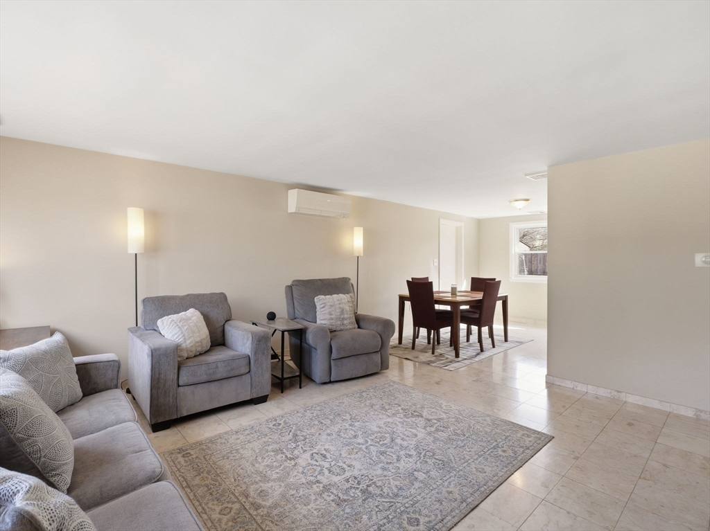 34 Beaconsfield Street Lawrence, MA 01843 - Photo 5 of 29 a living room with furniture and view of kitchen