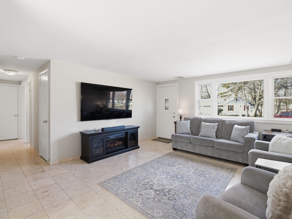 34 Beaconsfield Street Lawrence, MA 01843 - Photo 7 of 29 a living room with furniture and a flat screen tv