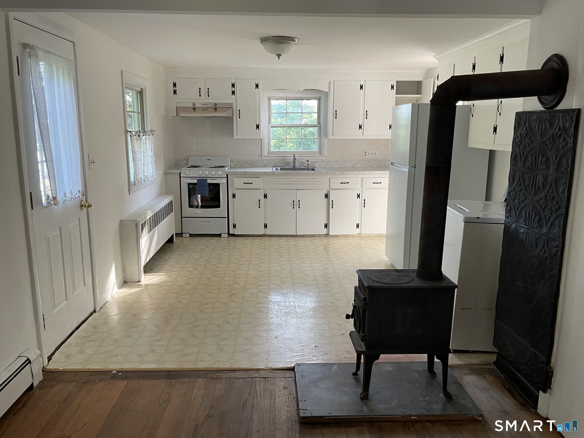 8 Prospect Hill Deep River, CT 06417 - Photo 7 of 16 a kitchen with stainless steel appliances kitchen island a refrigerator sink and cabinets