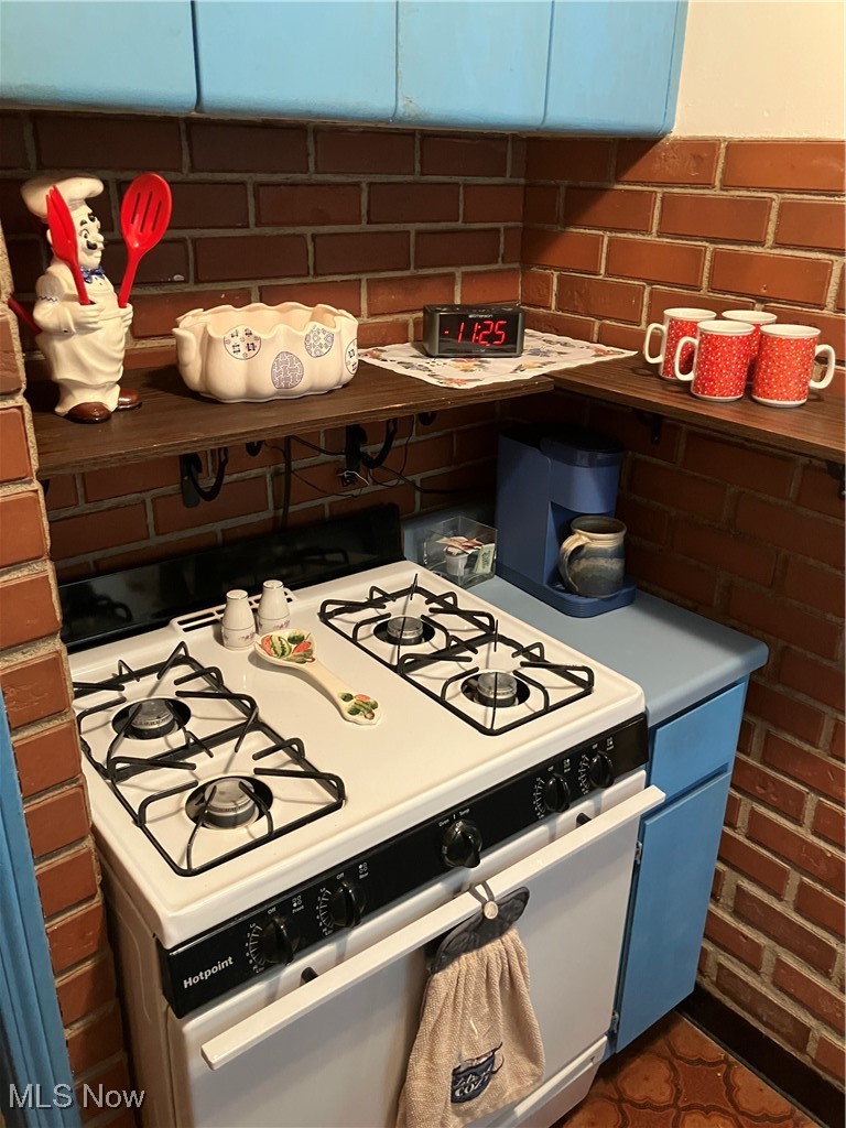 12924 Orme Road Cleveland, OH 44125 - Photo 27 of 27 Kitchen featuring gas range gas stove and blue cabinets