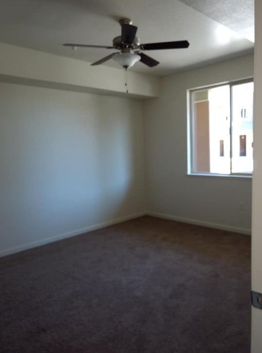 2300 Loveridge Road Pittsburg, CA 94565 - Photo 12 of 14 an empty room with a window and a fan