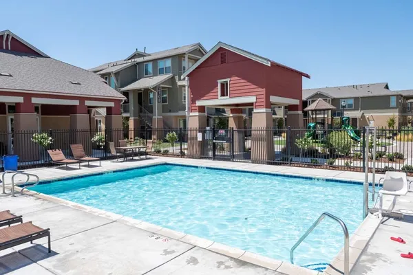 a front view of a building with outdoor seating
