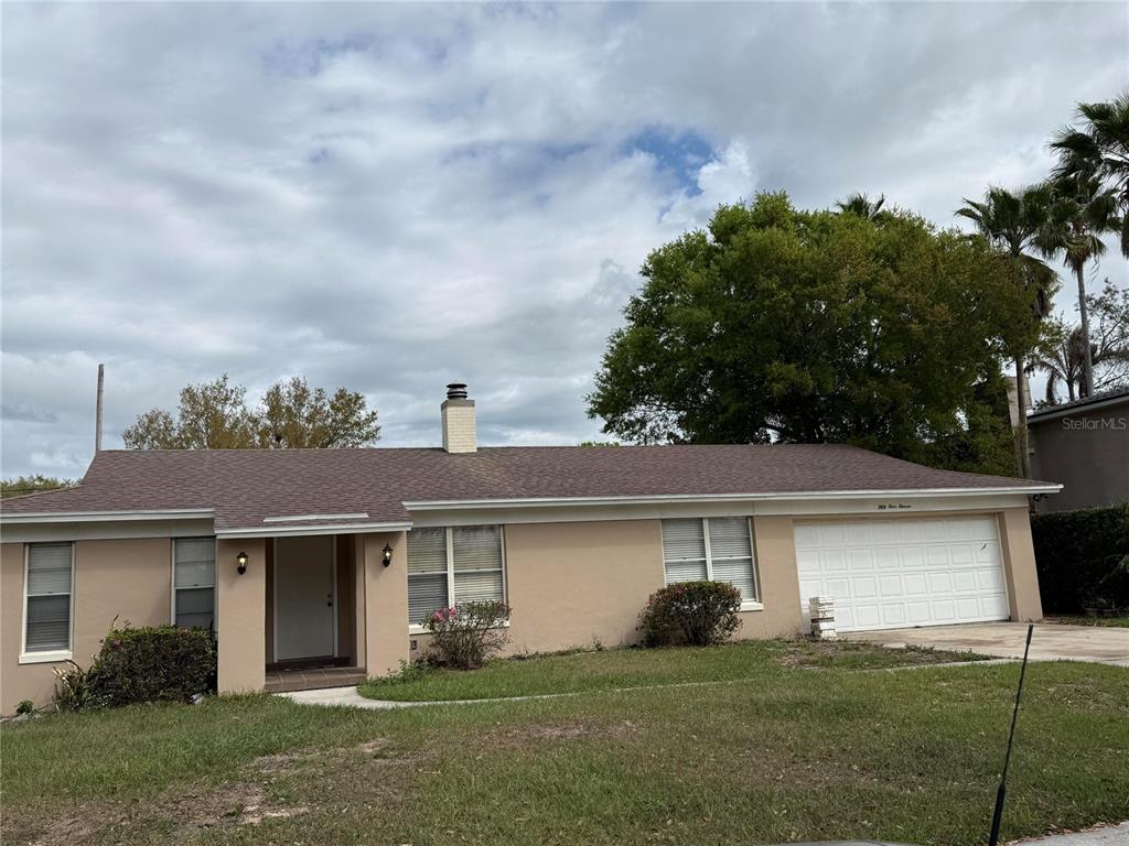 front view of a house with a yard