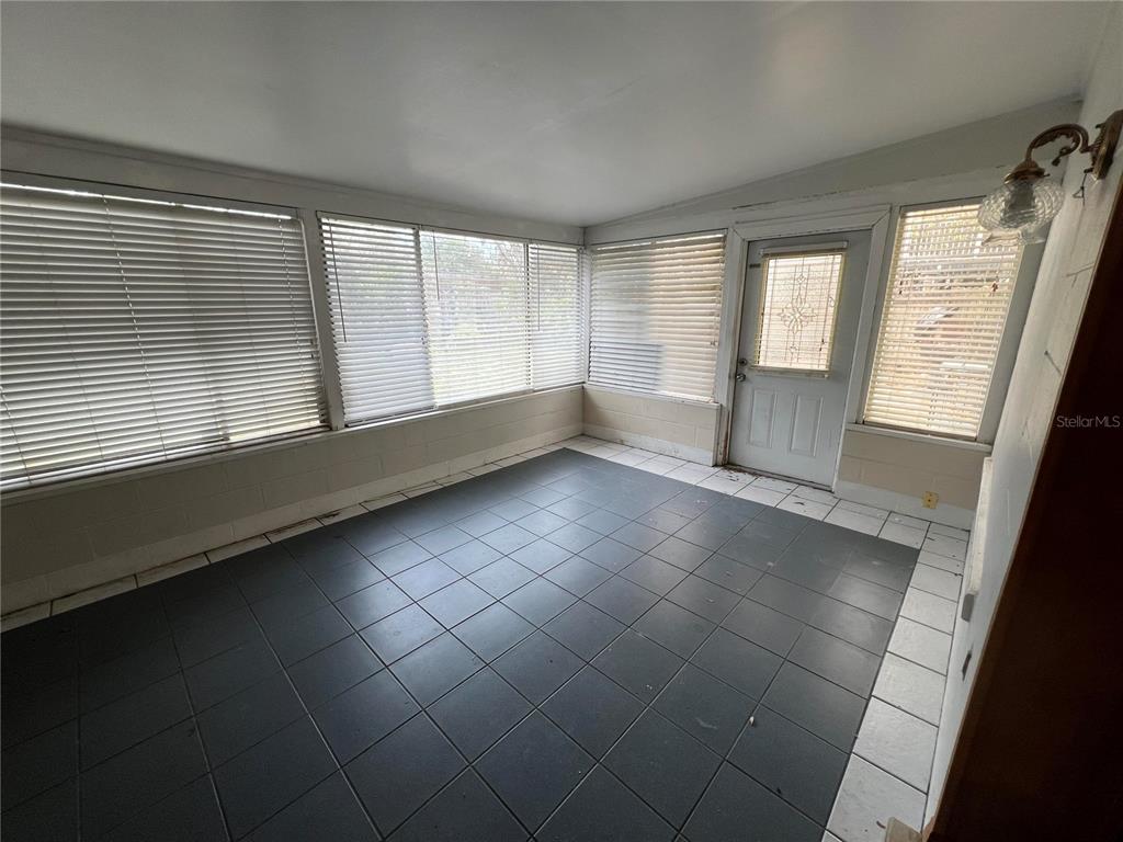 5411 Myrica Road Orlando, FL 32810 - Photo 14 of 26 a view of an empty room with a window