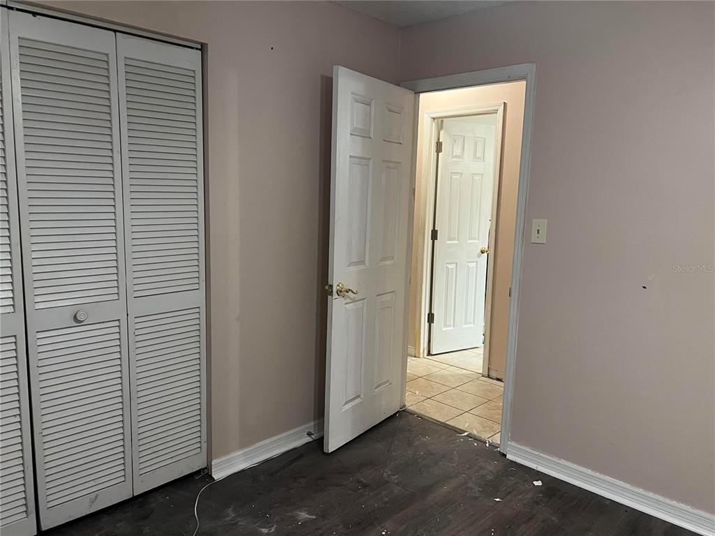 5411 Myrica Road Orlando, FL 32810 - Photo 21 of 26 an empty room with windows