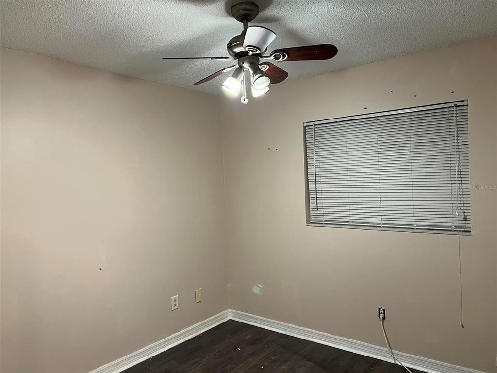 5411 Myrica Road Orlando, FL 32810 - Photo 24 of 26 a view of empty room with wooden floor