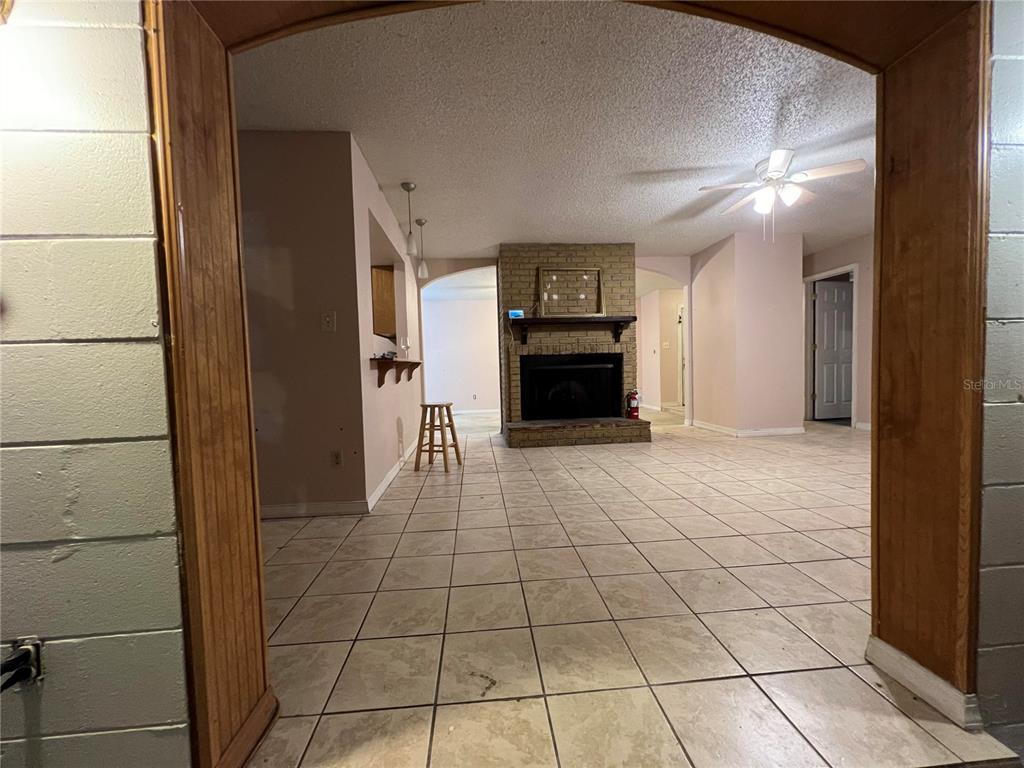 5411 Myrica Road Orlando, FL 32810 - Photo 7 of 26 a view of livingroom with furniture and flat screen tv