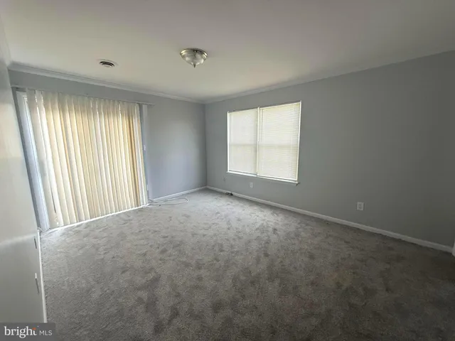 a bathroom with a sink a toilet a mirror and a tub