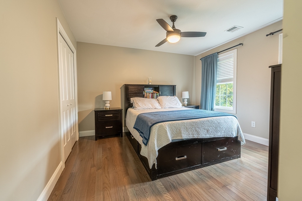 14 Whitin Heights Douglas, MA 01516 - Photo 21 of 42 a bedroom with a bed and a ceiling fan