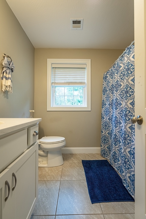 14 Whitin Heights Douglas, MA 01516 - Photo 26 of 42 a bathroom with a toilet a window and shower