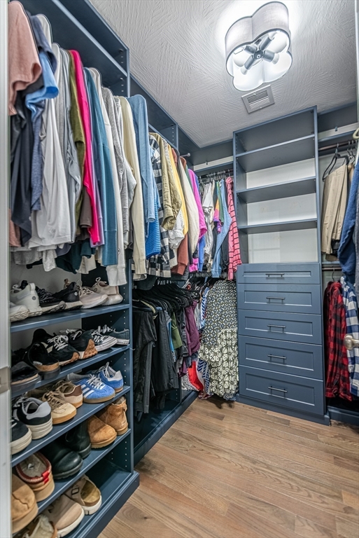 14 Whitin Heights Douglas, MA 01516 - Photo 33 of 42 a view of walk in closet with clothes and shoes