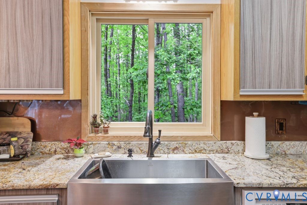 1061 Turkey Ridge Drive Moseley, VA 23120 - Photo 9 of 51 a kitchen with granite countertop a sink and a window