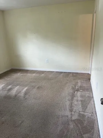 an empty room with a bench