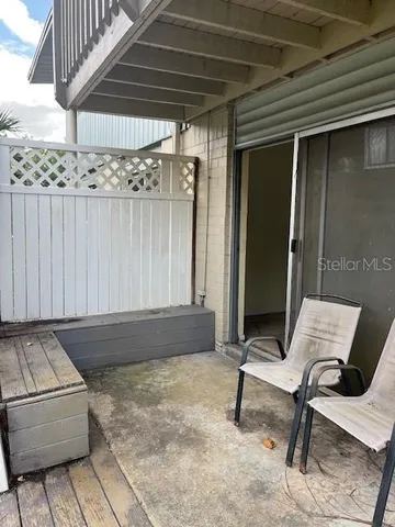 a outdoor space with lots of furniture and shower