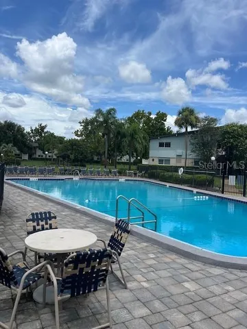 a view of swimming pool with a yard