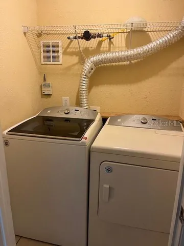 a utility room with dryer and washer