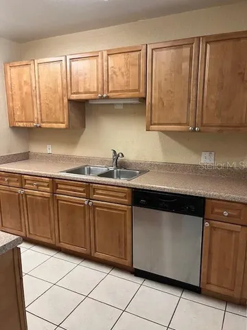 a kitchen with granite countertop cabinets and sink