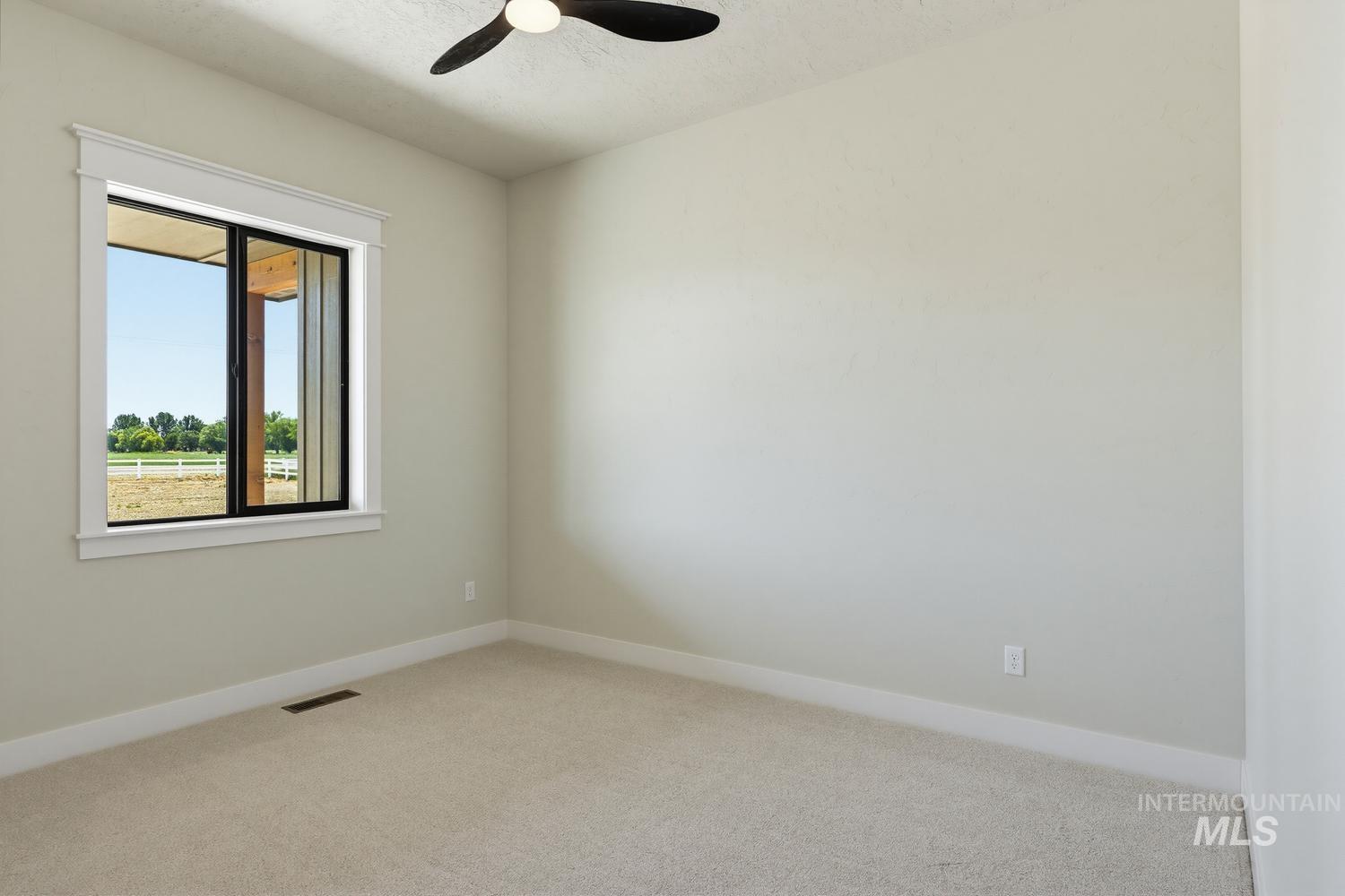 5054 Heritage Drive Marsing, ID 83639 - Photo 23 of 38 Neutral-toned walls complement plush carpeting