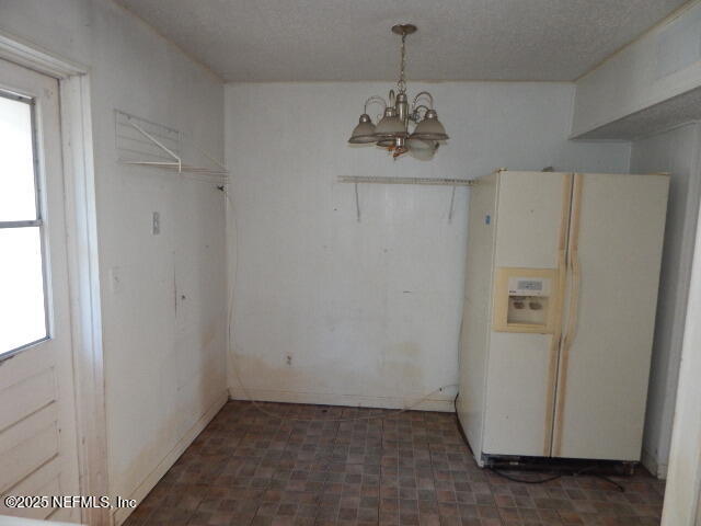 9790 Hogan Road Jacksonville, FL 32246 - Photo 3 of 11 a view of an empty room with a window