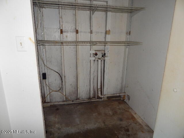 9790 Hogan Road Jacksonville, FL 32246 - Photo 6 of 11 a view of a room with rack on the wall