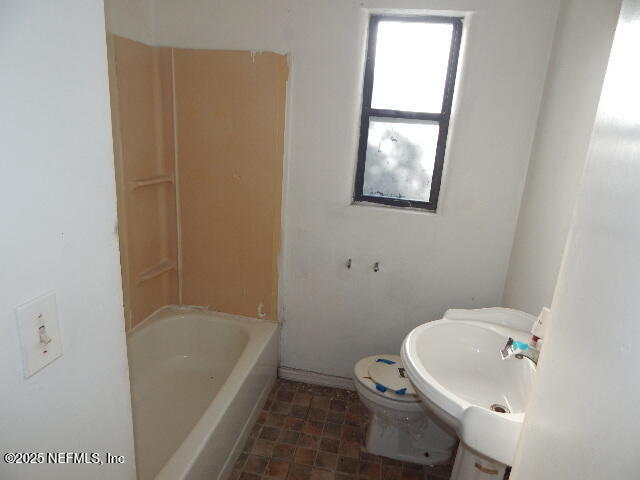 9790 Hogan Road Jacksonville, FL 32246 - Photo 9 of 11 a bathroom with a sink and bathtub