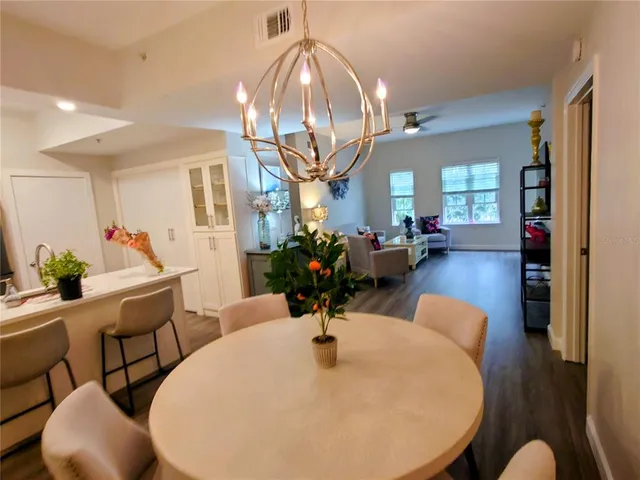 a view of a dining room with furniture and wooden floor