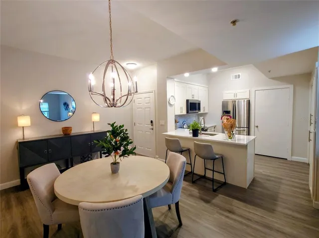 a kitchen with a table and chairs