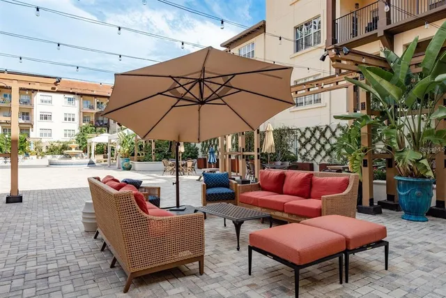 a outdoor space with patio the couches and a umbrella