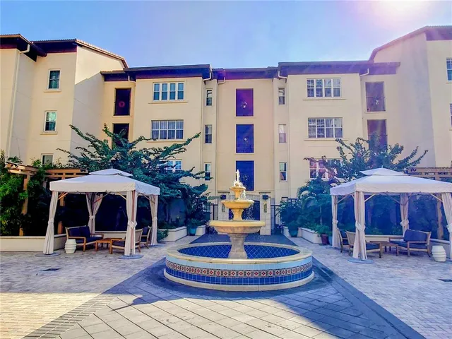 a front view of a building with sitting area