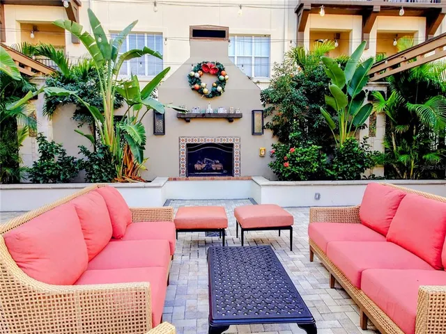 a swimming pool with outdoor seating