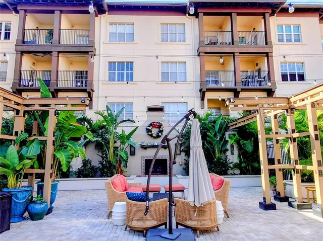 a building with potted plants in front of it