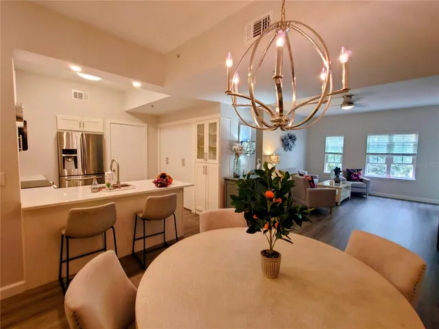 a view of a livingroom with furniture and a chandelier