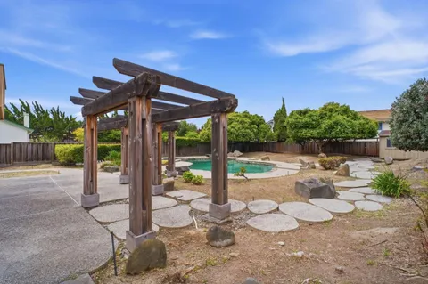 a view of swimming pool with seating space