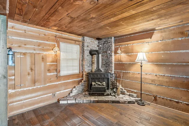 a bathroom with a granite countertop window and a shower