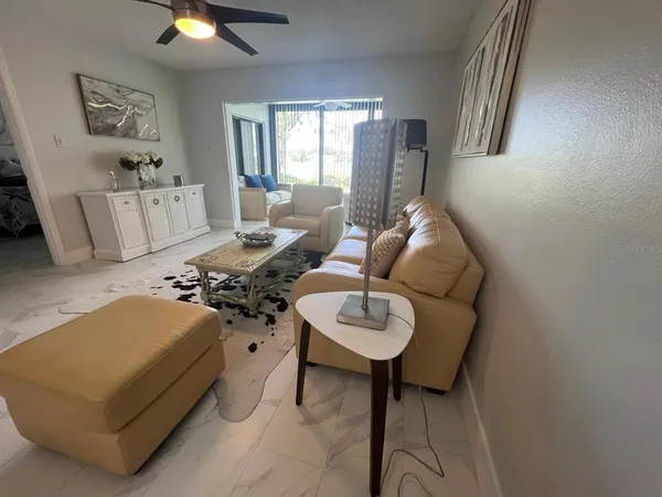 a living room with furniture and a large window