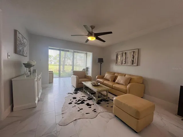 a bathroom with a toilet a sink a mirror a vanity and window