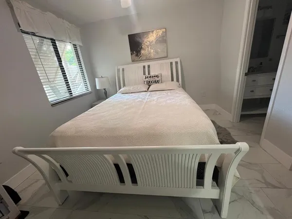 a bathroom with a sink mirror and toilet