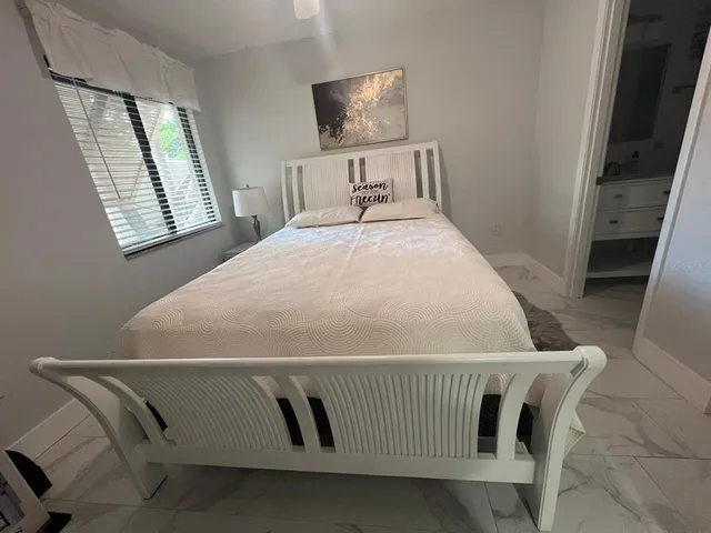 a bathroom with a sink mirror and toilet