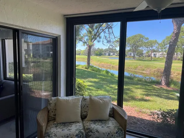 a view of swimming pool with an outdoor space and seating area