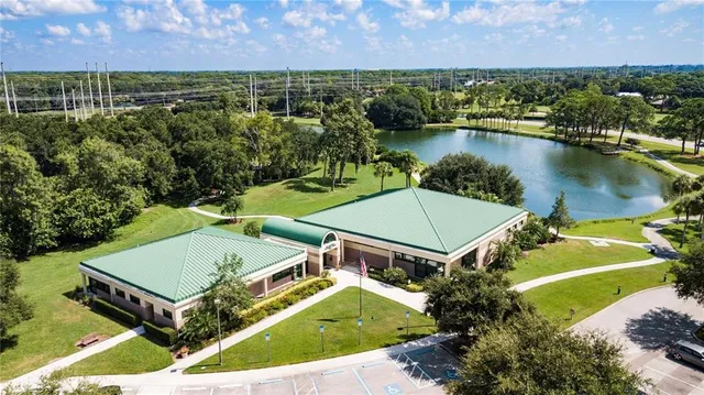 an aerial view of a house with a lake view