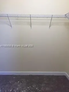 a bathroom with a shower sink and mirror