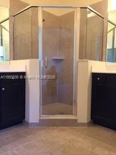 a bathroom with a sink a mirror and a bathtub