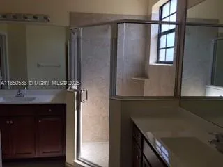 a kitchen with a refrigerator and a sink