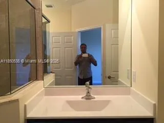 a bathroom with a sink a toilet and bathtub