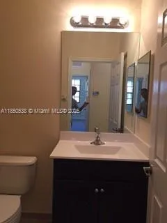a bathroom with a toilet and sink