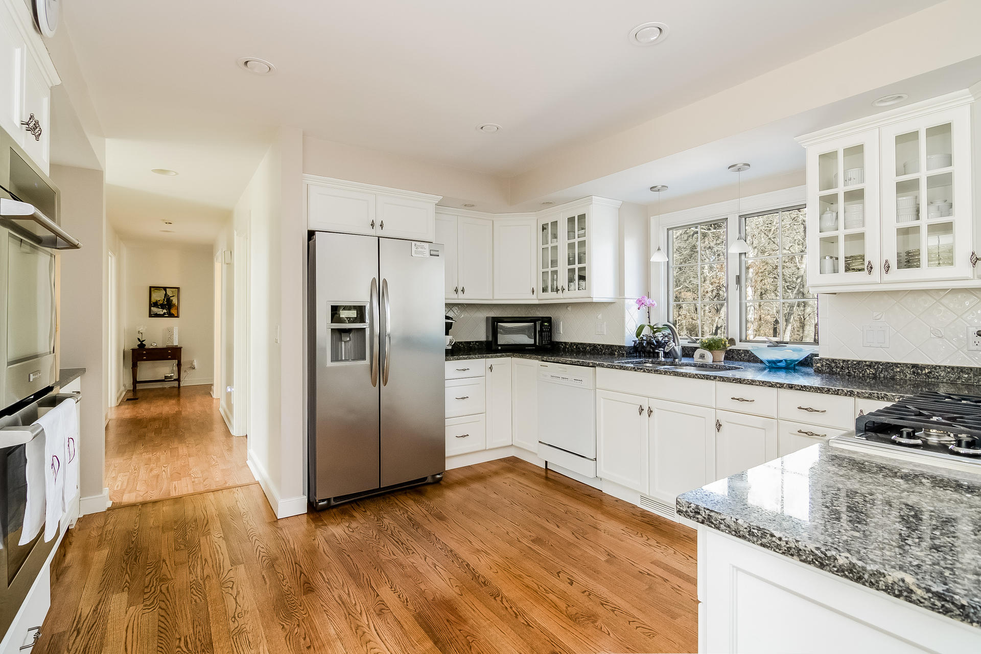 21 Marshview Lane Brewster, MA 02631 - Photo 11 of 37 a kitchen with granite countertop a refrigerator and a sink